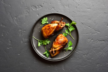 Roasted quails on plate - obrazy, fototapety, plakaty