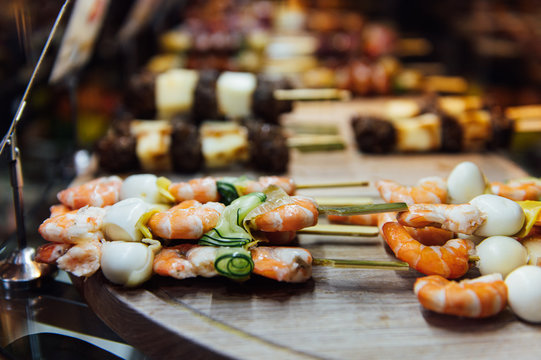 A wide variety of traditional tapas with seafood in Spain at the San Miguel market