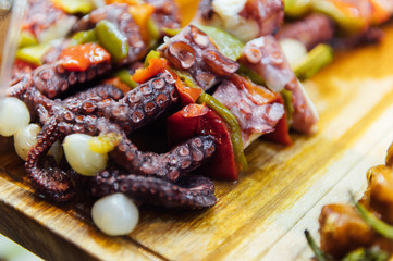 A wide variety of traditional tapas with seafood in Spain at the San Miguel market