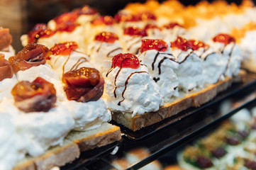 Naklejka premium A wide variety of traditional tapas with seafood in Spain at the San Miguel market