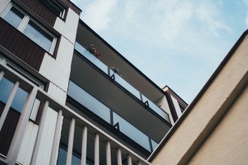 Low angle shot of a modern building touching the clear sky