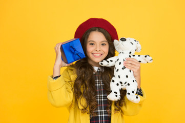 Little shopaholic. happy holiday greeting. parisian girl with dog toy and present box. small souvenir from france. paris spirit. trendy little girl french beret. happy birthday. shopping time