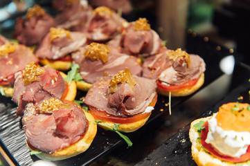 A wide variety of traditional tapas with seafood in Spain at the San Miguel market