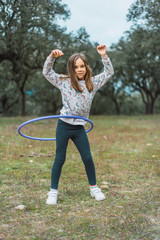 girl in the forest with hula hoop