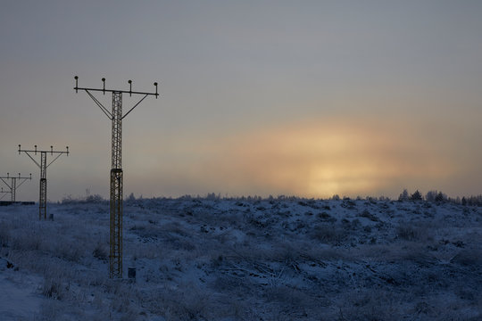 Electricity pylons at sunset