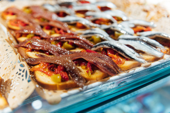 A wide variety of traditional tapas with seafood in Spain at the San Miguel market