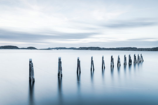 Wooden poles at sea