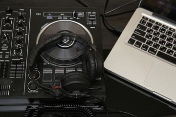  DJ equipment, controller or mixer, headphones, laptop. Music background, banner, card. Modern...