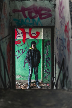 Teenage boy inside abandoned building