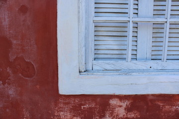 old window with red shutters