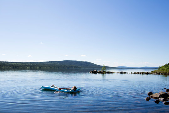 Boy on inflatable raft