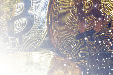 Golden bitcoins on a black computer keyboard