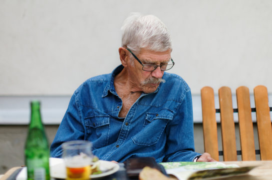 Senior man sitting outside