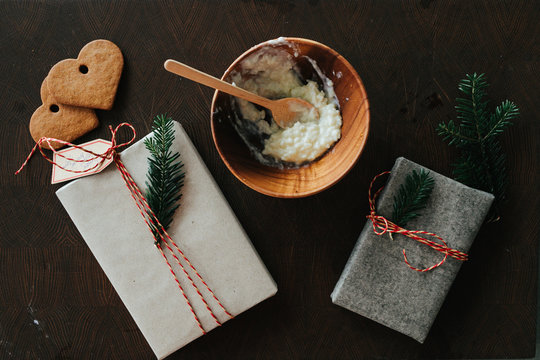 Christmas gifts and bowl with porridge