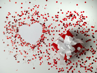 Surprise gift. Red polka dot box with white bow on background with confetti. heart. the view from the top