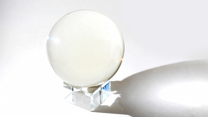 Religious round glass balls placed on a crystal platform isolated on white background. Magic ball.