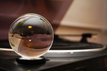 Glass sphere with reverse reflection in hand