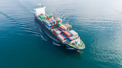Fototapeta na wymiar Large container ship at sea. Aerial top view of cargo container ship vessel import export container sailing.