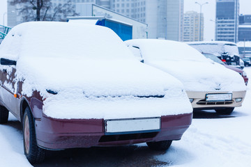 Car under snow in winter.