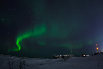 Aurora borealis in night northern sky. Ionization of air particles in the upper atmosphere.