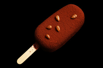 Chocolate and caramelized sunflower seeds gelato with textured glaze top view