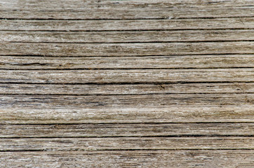 gray wooden background. Old dry boards. Wood texture. bridge or pier in the village near the river.