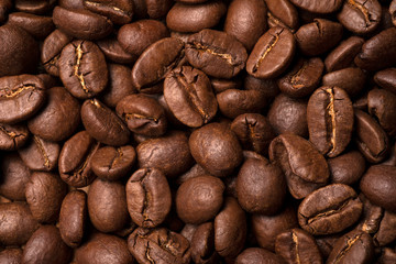 Brown coffee beans close-up. View from above.