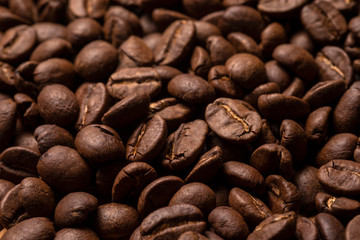 Beautiful large roasted coffee beans close-up.