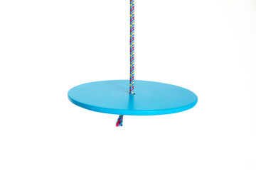 Closeup of plastic disc swings on white