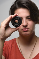 young woman with photographic lens