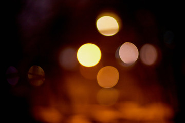 Abstract texture with light bokeh and black background