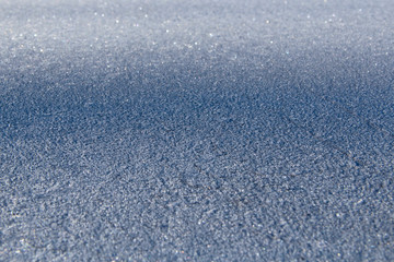 Obraz na płótnie Canvas Surface of wall covered with hoar-frost in winter. Winter texture frozen in time