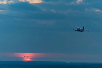 Fototapeta na wymiar View of airplane going up against beautiful sky