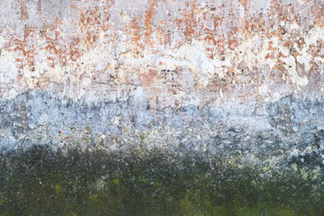 Abstract texture of old colorful wall with grain and scratches. Beautiful, artistic, creative background. White, orange, green and grey rough weathered stone texture. Copy space