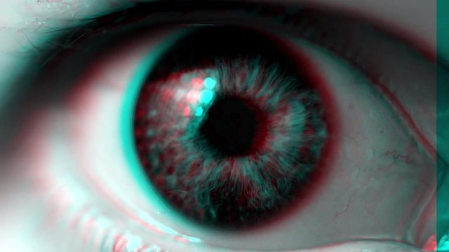 Spooky female eye macro footage with digital glitch effect