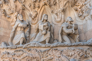 Exterior details on facade of cathedral  called Sagrada Familia. Religious Christian statues in the famous church in Barcelona, Spain