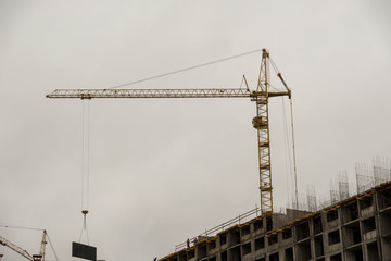 Construction of a new residential building. Apartments are made using brick-monolithic technology. First, pour concrete into the walls, build a frame. Then lay a brick for the walls. It turns out huge