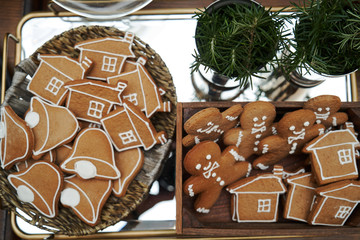 Christmas festive table with dessert cookies in shape of gingerbread man