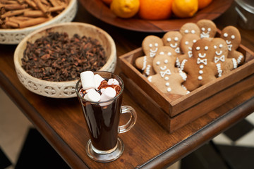 Christmas festive table with dessert cookies in shape of gingerbread man