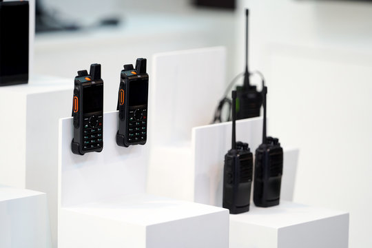 Portable radio transceiver sets on white background, close-up