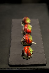 Group of chocolate dipped strawberries gourmet dessert selective focus