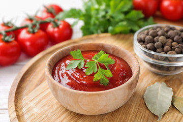 Delicious fresh tomato sauce on table, closeup