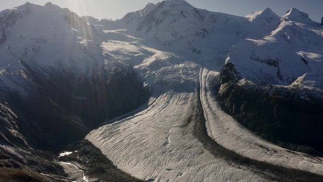 Pan upwards on Gornerglacier near Zermatt in switzerland, full glacier in wide view