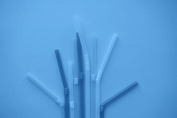 Single-use plastic straws in trendy blue colour.