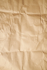 brown wrapped paper texture backdrop. vertical orientation.