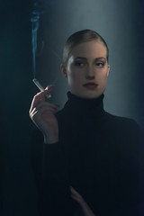 Fototapeta premium Retro 1940s woman with cigarette in black turtleneck sweater.