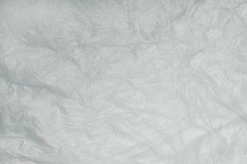 Abstract texture of light crumpled polyethylene, plastic for recycling, concept of ecology, environmental pollution
