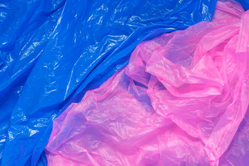 bright multicolored abstract background of used color polyethylene bags, environmental pollution concept