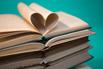 stack of books on green background