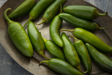 Close up of green chili peppers.